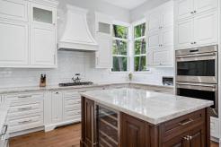 Another stunning project completed with Schrapper’s Private Label Inset Cabinetry. 
The contrasting Cherry island stands out beautifully against the light palette of white and Cristallo quartzite.