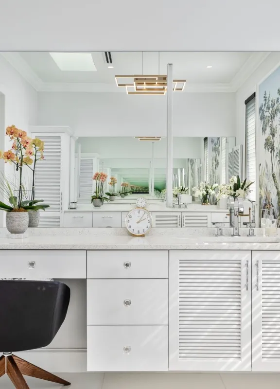 Custom bathroom vanity and makeup station with modern cabinet doors