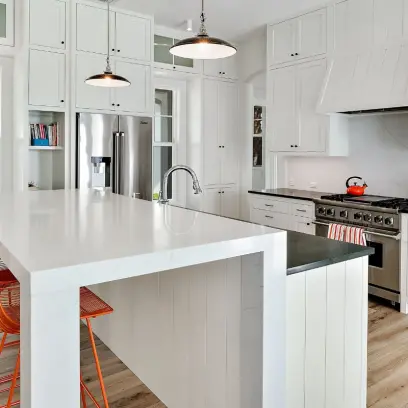 Custom kitchen with modern white cabinetry and countertops