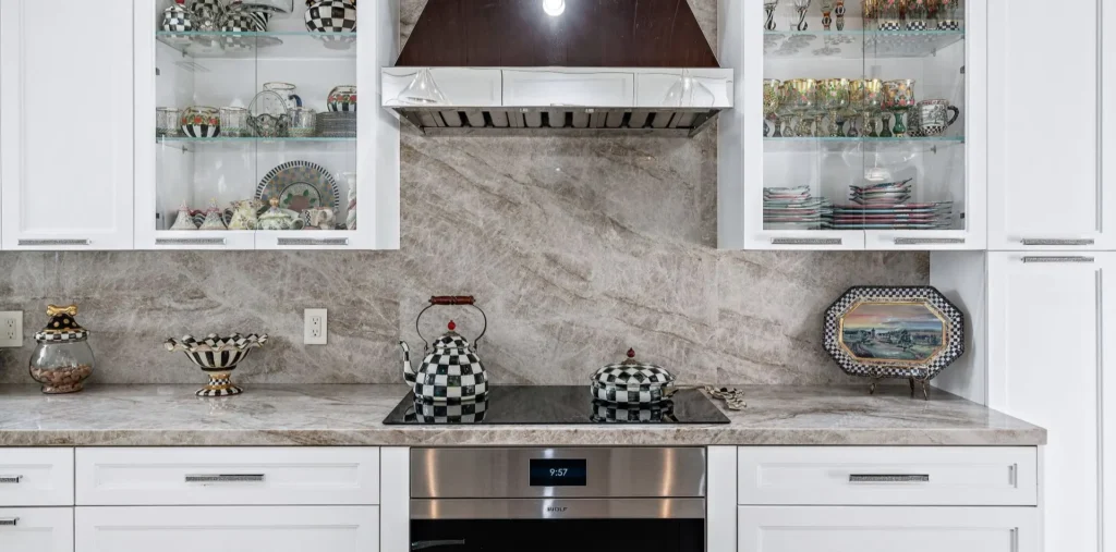 Traditional kitchen design with glass-front cabinet doors, custom by Schrapper's Fine Cabinetry showing the visible quality of furniture-grade plywood box construction